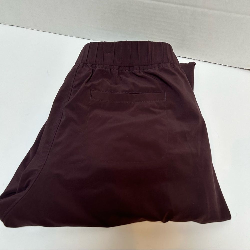 Athleta Aspire Ankle Pants Jogger Zipper Neverend Drawstring Maroon size 0